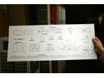 Styrene sheet with printed kit parts.